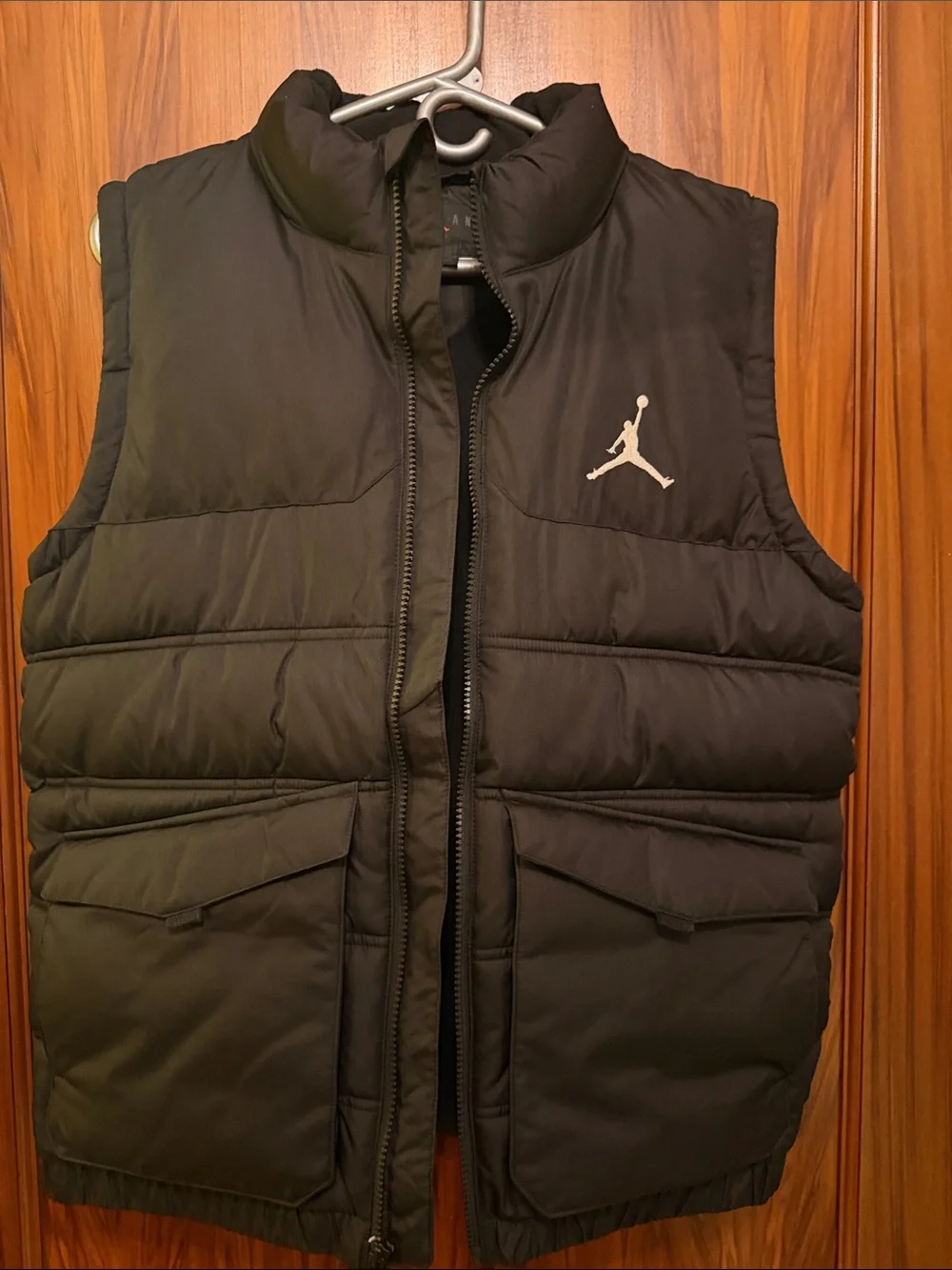 Jordan boys size xl Black Puffer Vest with White logo on front.
